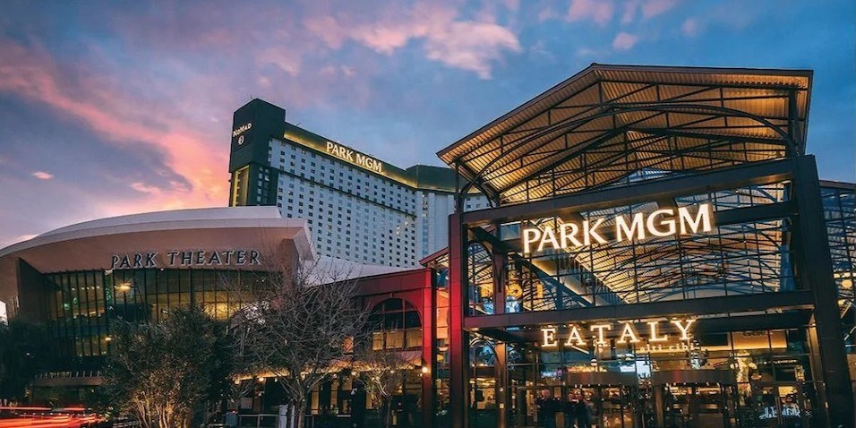 Exterior of Park MGM and Eataly at sunset on the Las Vegas Strip. Park Theater and Nomad Las Vegas are also in the background