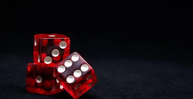 Red Sic Bo dice on a casino table